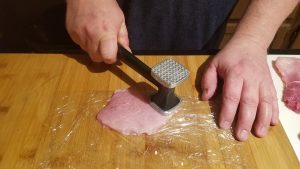 How to make Pork Schnitzel. Pound with mallet until as flat as possible