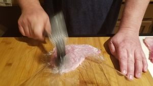 How to make Pork Schnitzel. Pound with mallet until as flat as possible